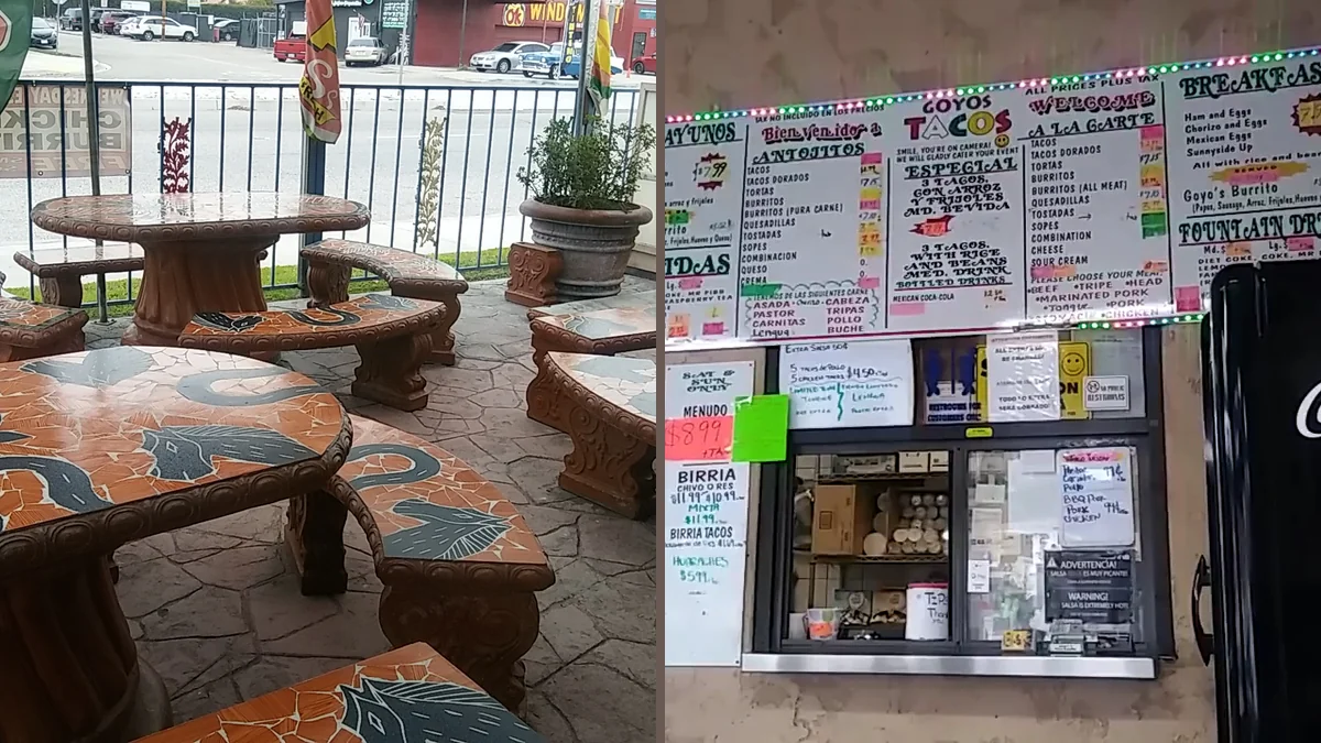 Outdoor seating beside a taco restaurant entrance.