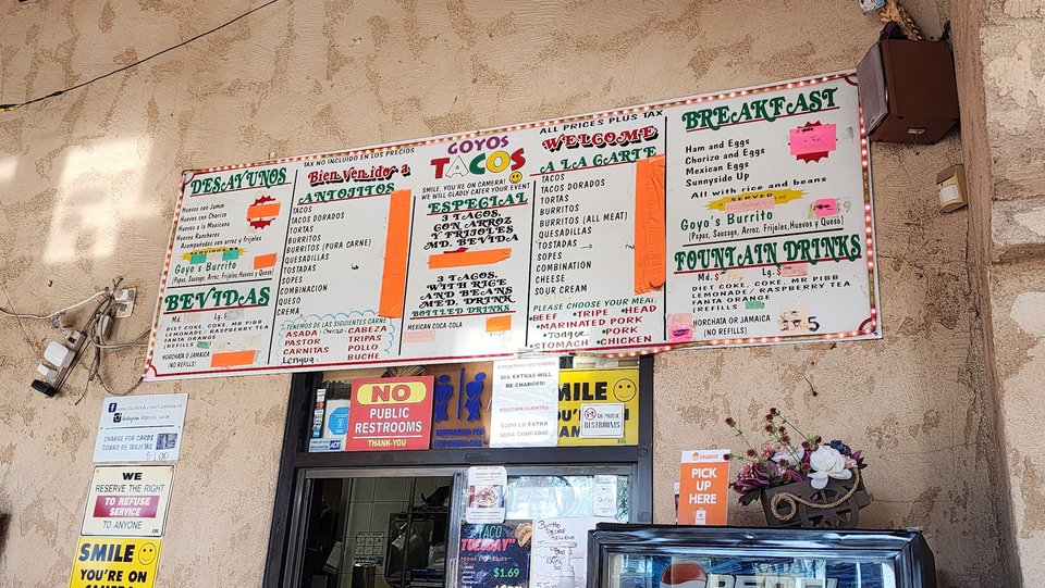 Counter service area with menu boards overhead.